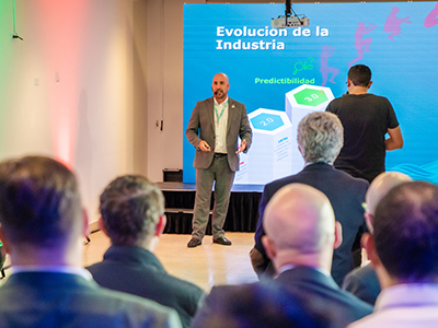 Ed giving a keynote at Bogota in front of projector screen,