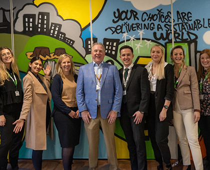 Ross standing next to Chris Ashton, CEO of Worley, and the rest of the STEM group.