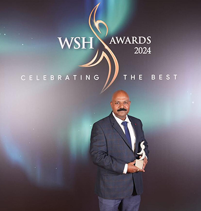 Yogesh holding an award.