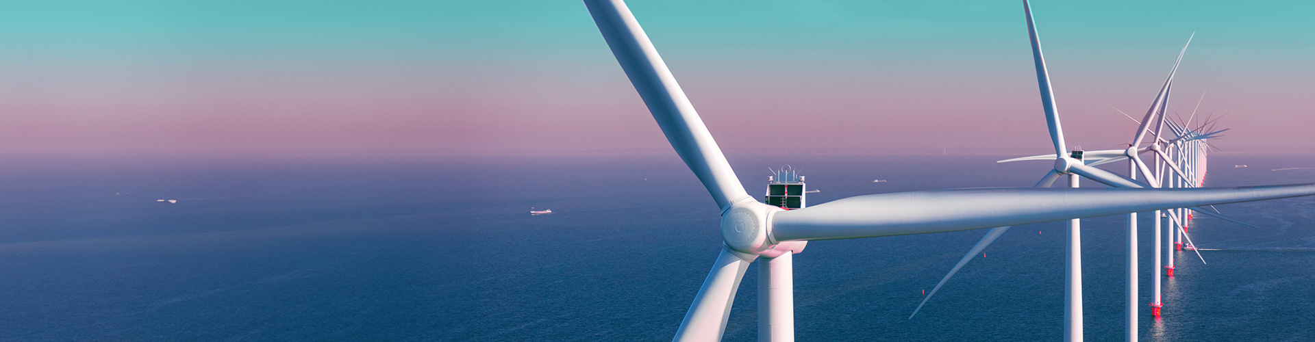 Row of offshore wind turbines.