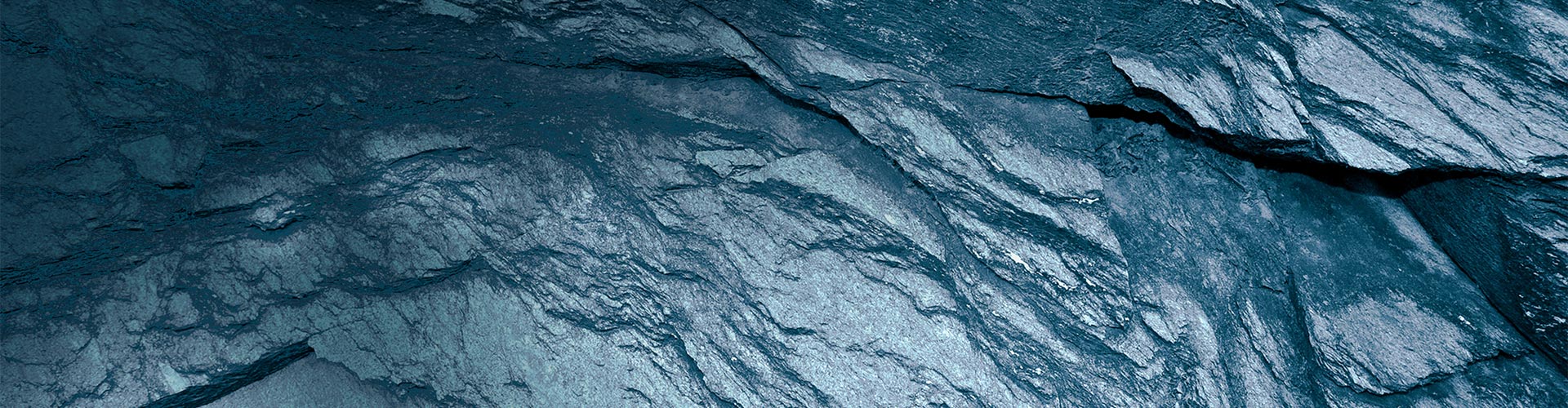  Dark gray metamorphic schist rock.