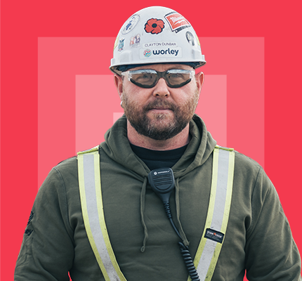 Worley worker wearing hard hat and safety glasses.