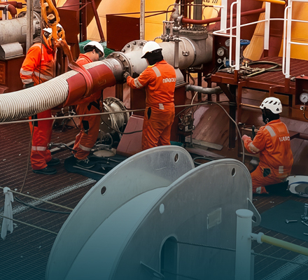 People wearing PPE working on an LNG tanker.
