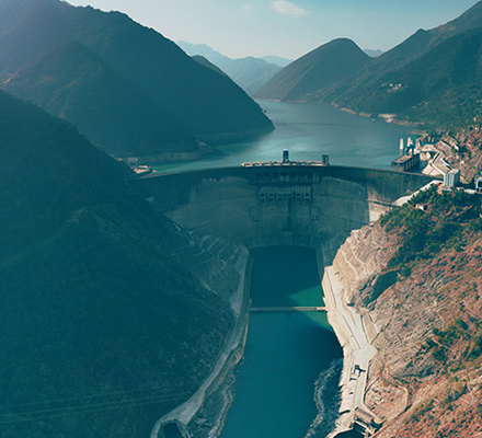Hydropower plant in the middle of large mountains.