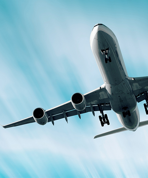 Looking up to the underside of a flying aeroplane.