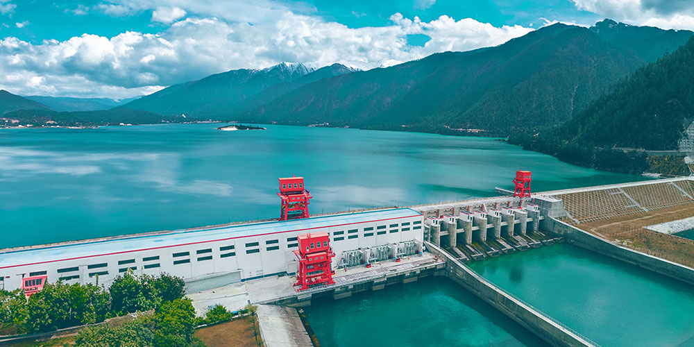 Hydropower plant at a large body of water.