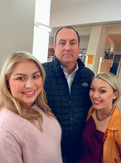 Andy with his two daughters.