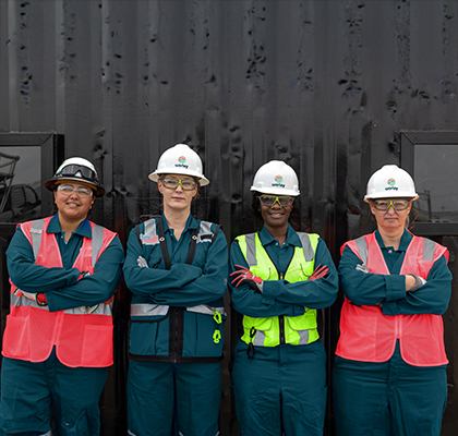 Four Worley women wearing PPE at a fabrication yard.