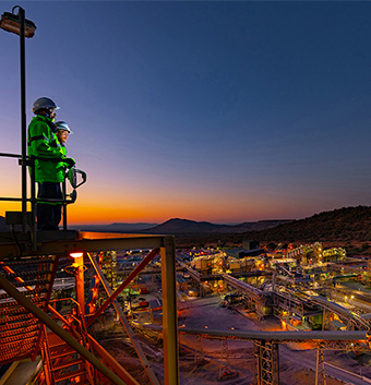 Two people looking over the Sedibelo Platinum mine.