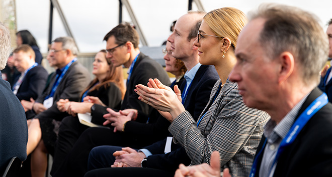 Audience applauding at the UK Breakfast Briefing.