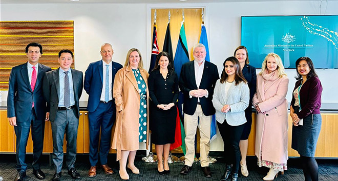 Gillian standing with a group of 9 others at the UN Headquarters.