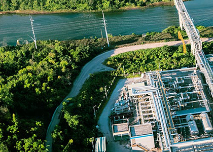 Aerial view of a chemcial plant with rooftops of solar panels.