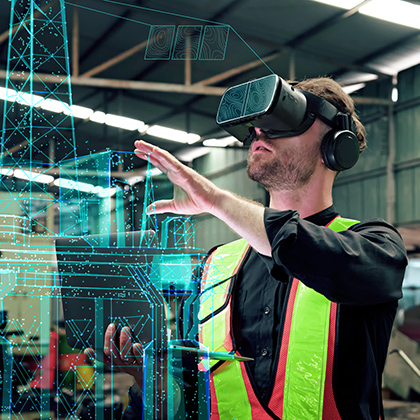 Industrial worker wearing a safety vest and mixed‑reality headset, interacting with a digital interface in a warehouse.