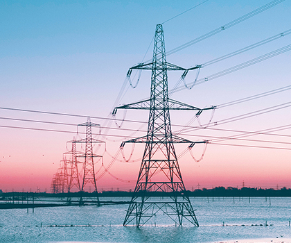 Looking down a row of a transmission lines.